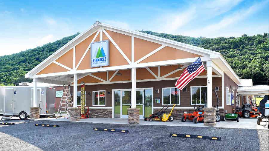 Pinnacle Rental Centers storefront in Corning, NY, beneath the hills of the Finger Lakes Region